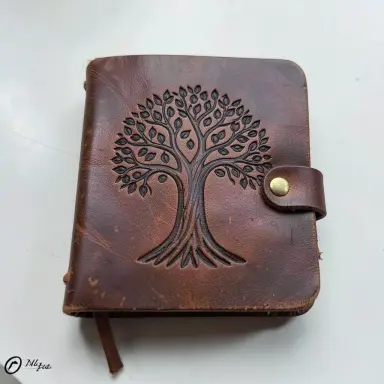tooled leather journal with a tree of life