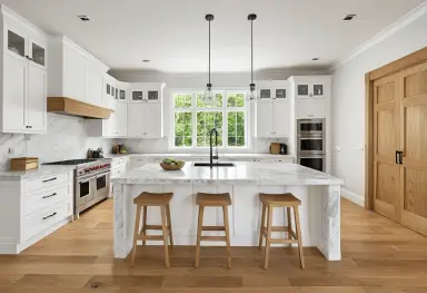 a kitchen with white marble and oak photograph